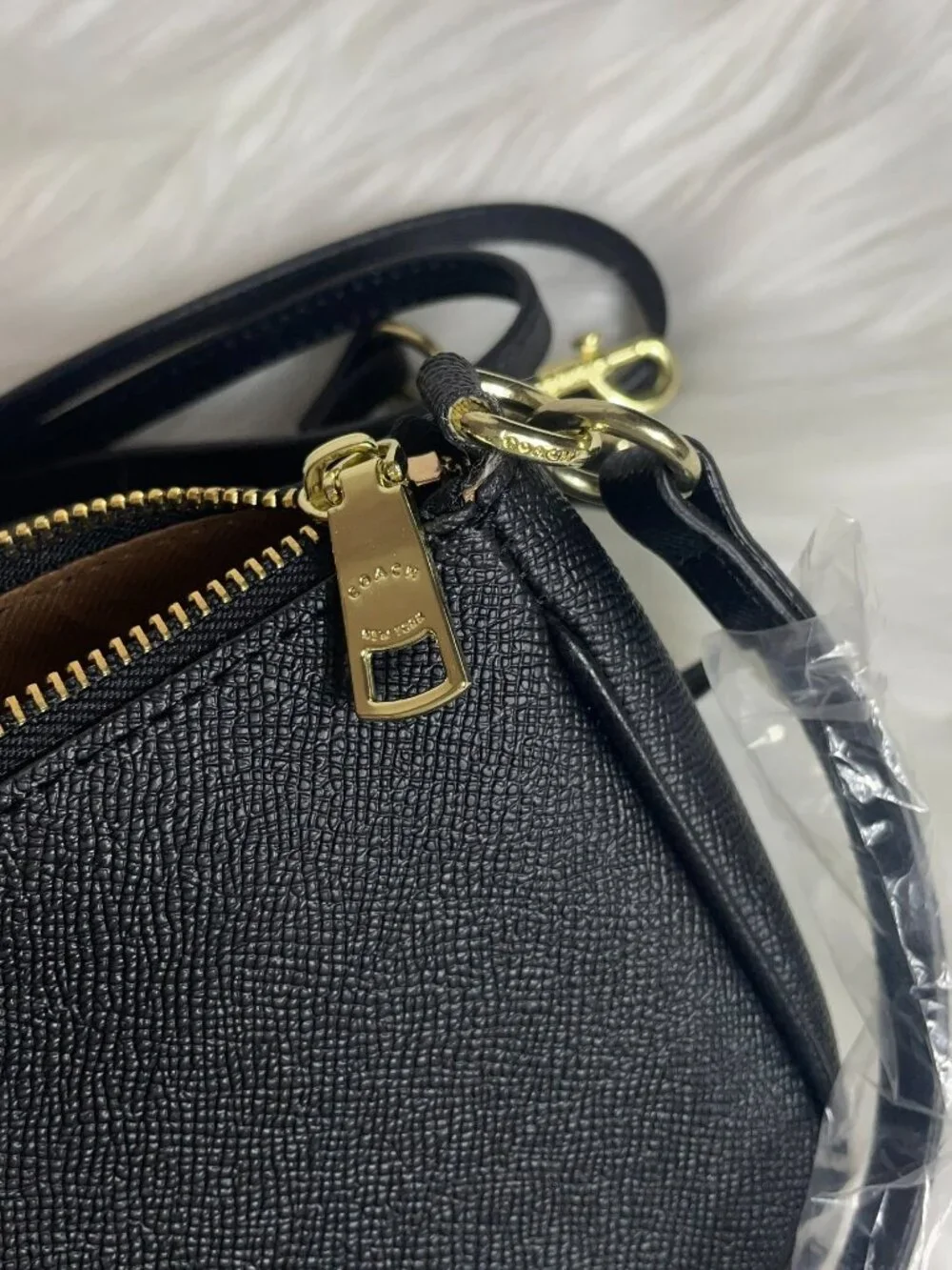 Black zipper top small shoulder bag with extra long strap